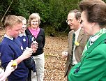 Local school children and Group Leader Sue Searle discuss how they are studying the wildlife in the woodland leaf litter.