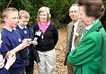 Local school children and Group Leader Sue Searle discuss how they are studying the wildlife in the woodland leaf litter.